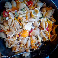 Whole wheat pasta salad with zucchini, tomatos, red bell peppers, purslane, green olives, capers, red onions, feta cheese with a red wine vinaigrette